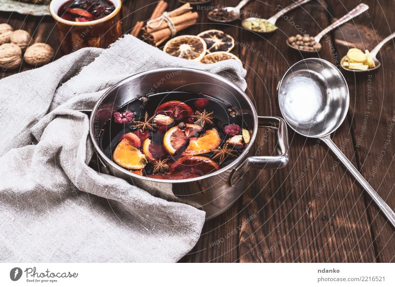 mulled wine in a pan Fruit Herbs and spices Beverage Alcoholic drinks Mulled wine Spoon Winter Table Feasts & Celebrations Christmas & Advent Wood Hot Above