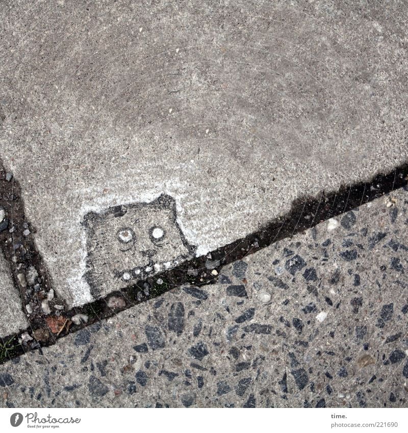 City faces. Goblin of St. Pauli. Animal Stone Concrete Line Brash Funny Gray Black Kobold Drawing Sidewalk Seam Tar Concrete slab Illuminate Diagonal Comic