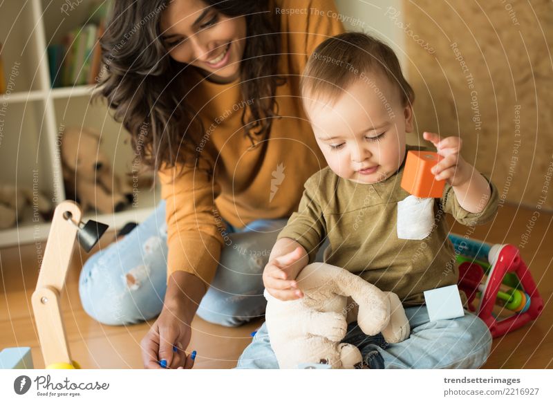 Mother playing with her baby - education methods concept Joy Happy Beautiful Playing House (Residential Structure) Child School Baby Toddler Woman Adults