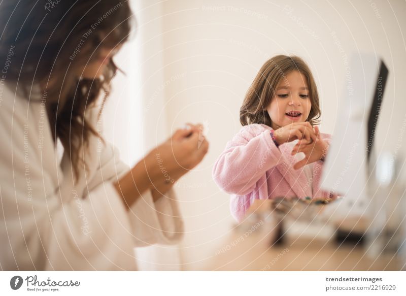 Little girl playing with her mother jewellery and make up Elegant Happy Beautiful Cosmetics Mirror Child Mother Adults Infancy Fashion Jewellery Smiling Small