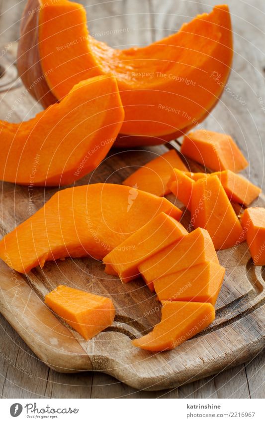 Pumpkin slices on a white wooden background Vegetable Nutrition Eating Vegetarian diet Thanksgiving Hallowe'en Autumn Wood Fresh Natural Yellow agriculture