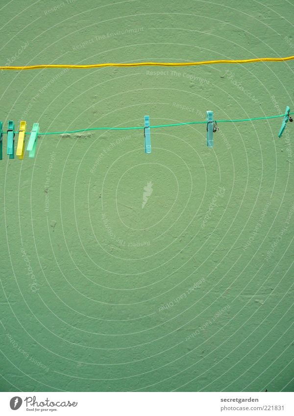 [HH 10.1] washing day. Wall (barrier) Wall (building) Facade Clothesline Clothes peg Line Yellow Green Colour Turquoise Rope Colour photo Exterior shot Close-up
