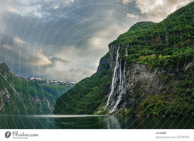 View of the Geirangerfjord in Norway Relaxation Vacation & Travel Tourism Mountain Nature Landscape Water Clouds Tree Rock Fjord Waterfall Tourist Attraction