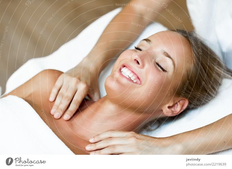 Young blond woman receiving a head massage in a spa center Lifestyle Happy Beautiful Skin Face Health care Medical treatment Wellness Relaxation Spa Massage