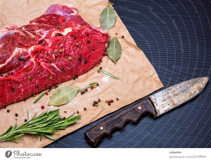 fresh piece of beef Meat Herbs and spices Dinner Knives Table Paper Wood Eating Fresh Natural Green Red Black Beef Blood Chop Cut Gourmet Ingredients Loin Meal