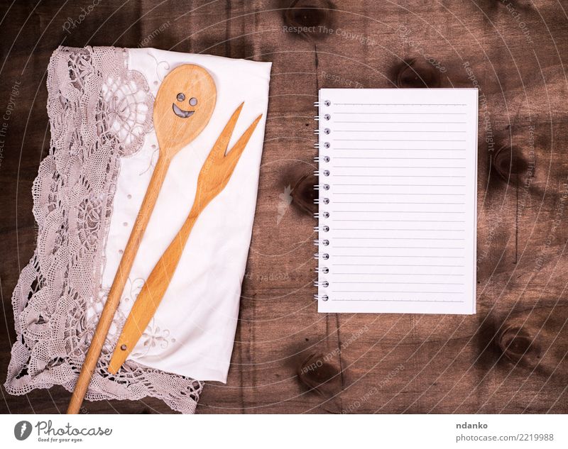open notepad in a line Fork Spoon Table Book Paper Wood Brown Meal Cookbook Blank Conceptual design Top recipe Cooking Ingredients Menu cookery Rustic Napkin