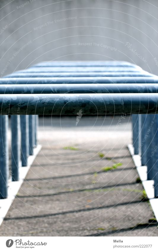 opportunities Deserted Places Bicycle rack Pillar Framework Metal Prop Gloomy Blue Gray Row Beaded Behind one another Colour photo Exterior shot Day Shadow