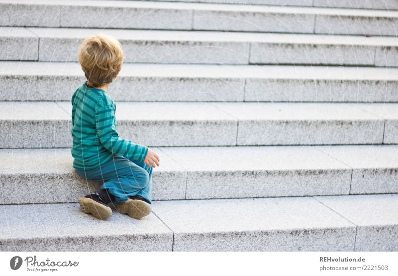 Child sitting on a staircase Human being Toddler Boy (child) Infancy 1 1 - 3 years Town Stairs Sweater Sneakers Observe Sit Wait Authentic Small naturally Gray