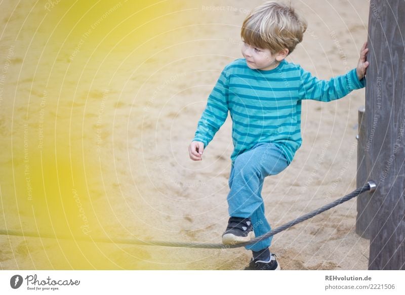 Child on the playground Leisure and hobbies Playing Boy (child) 1 Human being 3 - 8 years Infancy Playground Sand Movement Authentic Small Yellow turquoise Joy