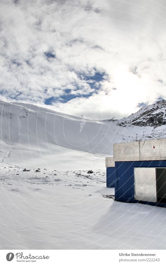 Supply hut in the snow on the Rettenbach Glacier Landscape Clouds Ice Frost Snow Rock Alps Mountain Austria Snowcapped peak Metal Glittering Tall Cold Above