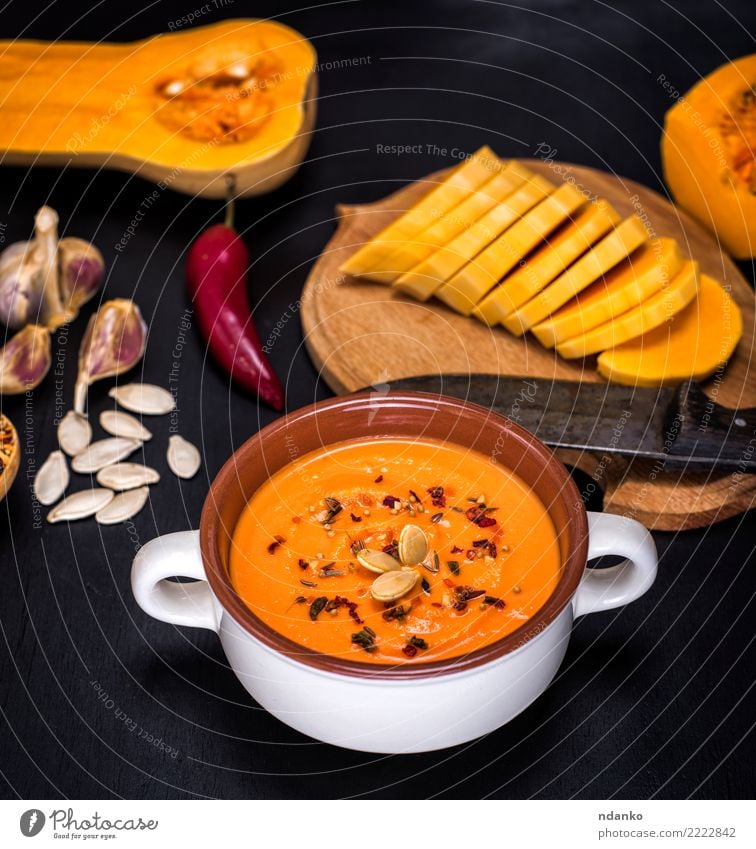 pumpkin soup in a ceramic plate Vegetable Soup Stew Herbs and spices Nutrition Eating Lunch Dinner Vegetarian diet Diet Plate Table Hallowe'en Nature Wood Fresh