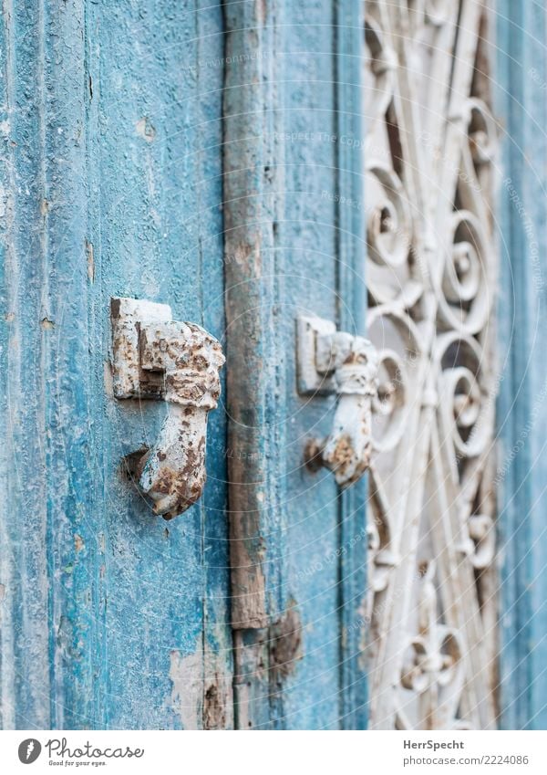 double-knob Door Old Exceptional Historic Retro Turquoise White Knocker Rust signs of ageing Patina Wooden door Detail Close-up Colour photo Exterior shot