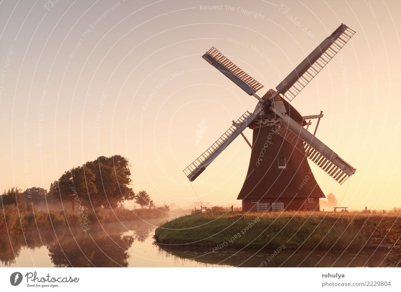 charming windmill by river at sunrise Vacation & Travel Culture Nature Landscape Sky Sunrise Sunset Sunlight Summer Beautiful weather Fog River Building