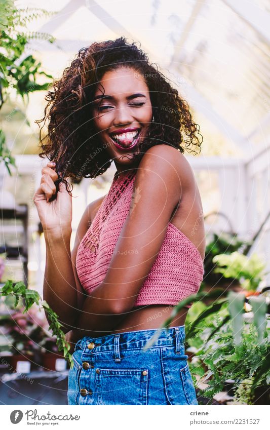 Portrait of young african woman stretching out tongue Lifestyle Joy Happy Human being Feminine Young woman Youth (Young adults) Woman Adults 1 Afro Smiling