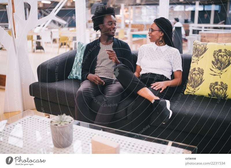 Young african businesspeople having conversation in office Lifestyle Sofa Work and employment Office Business Meeting To talk Feminine Youth (Young adults)