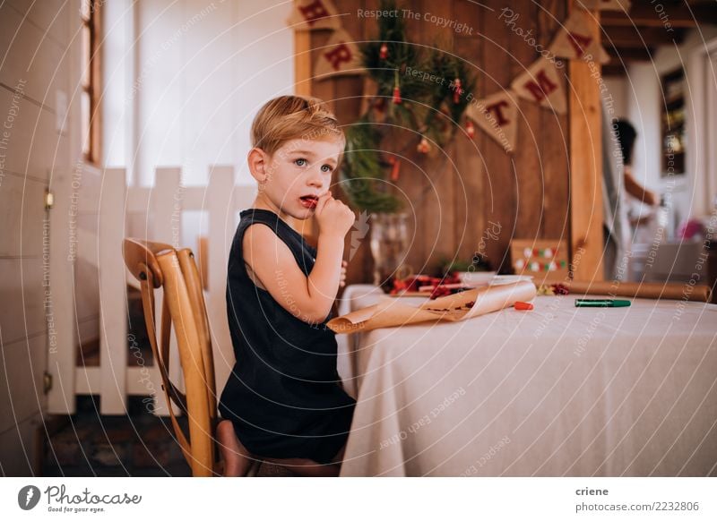 Caucasian little toddler eating christmas candy Eating Winter Table Living room Christmas & Advent Child Toddler Boy (child) 1 - 3 years 3 - 8 years Infancy