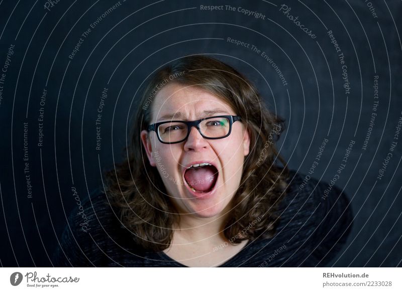 woman screams in front of a black wall Human being Feminine Young woman Youth (Young adults) Woman Adults Face 1 30 - 45 years Eyeglasses brunette Long-haired
