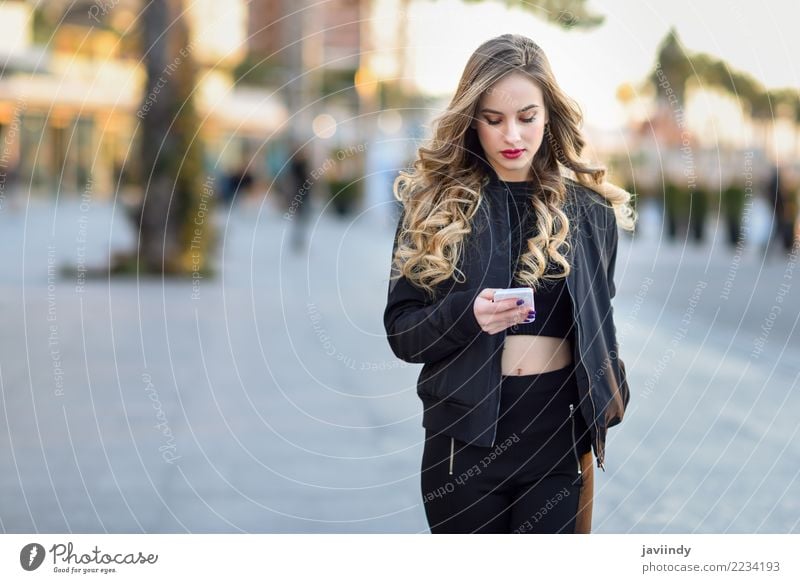 Woman texting with her smart phone in urban background Lifestyle Style Beautiful Hair and hairstyles Telephone PDA Human being Feminine Young woman