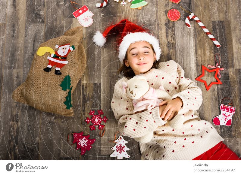 Little girl wearing santa hat sleeping on wooden floor Happy Beautiful Decoration Christmas & Advent Child Girl Woman Adults Infancy 1 Human being 3 - 8 years