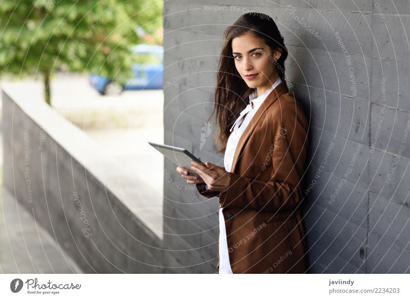 Young businesswoman with tablet computer standing outside of an office building Beautiful Hair and hairstyles Workplace Office Business Career Human being