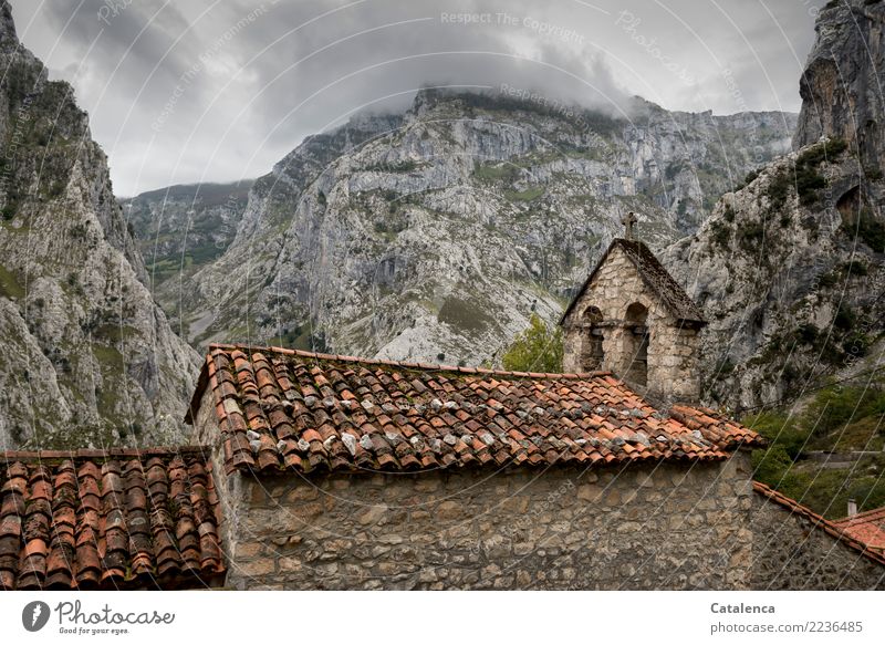 Chapels in the mountains Landscape Storm clouds Summer Bad weather Grass Bushes Rock Mountain Church Facade Roof Roofing tile Bell tower Crucifix bells Old