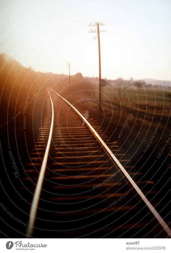 Gran tourismo Blur Railroad Railroad tracks Sunset Sunrise Ambiguous Twilight Central perspective Electricity pylon Nature Meadow Field Sunbeam