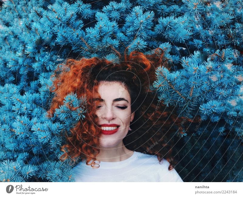 Young and happy redhead woman leaning in blue nature Exotic Joy Beautiful Hair and hairstyles Face Human being Feminine Young woman Youth (Young adults) 1