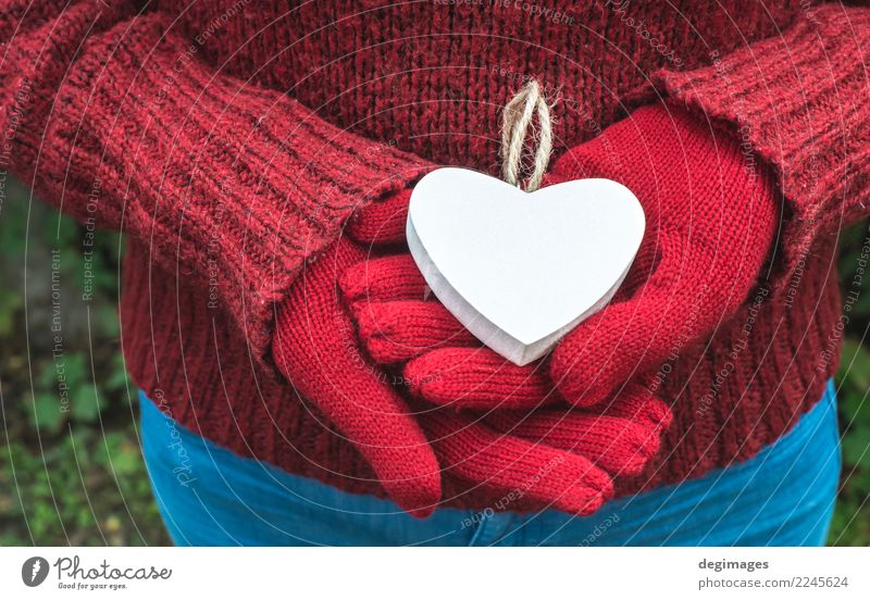 Hands in gloves and white heart Beautiful Winter Valentine's Day Woman Adults Nature Gloves Heart Love Red White Romance valentine Symbols and metaphors mittens