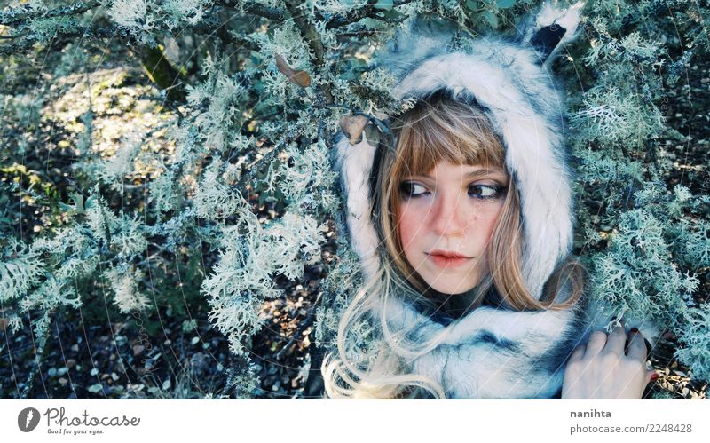 Young woman wearing a fur hat in the forest Style Exotic Beautiful Skin Face Senses Human being Feminine Youth (Young adults) 1 18 - 30 years Adults Environment