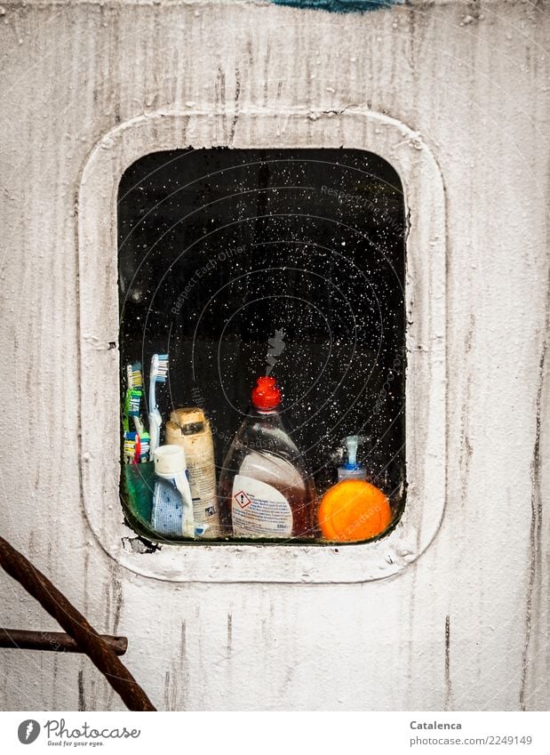 Curious |View through the porthole of a fishing boat Fisherman Porthole Navigation Fishing boat Toothpaste Shampoo Toothbrush Green Orange Black White Moody