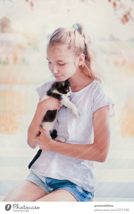 Beautiful girl squatting on the porch and hugging her little cat Lifestyle Happy Summer Sun Sunbathing Human being Girl Young woman Youth (Young adults) Woman