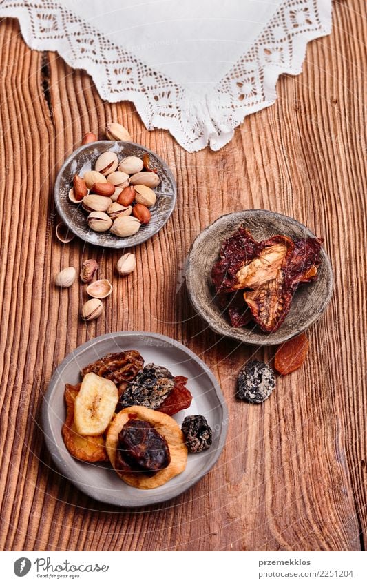 Dried fruits and nuts in handmade pottery bowls Food Fruit Dessert Bowl Table Wood Rust Delicious Above ceramic healthy overhead Rustic Snack sweet