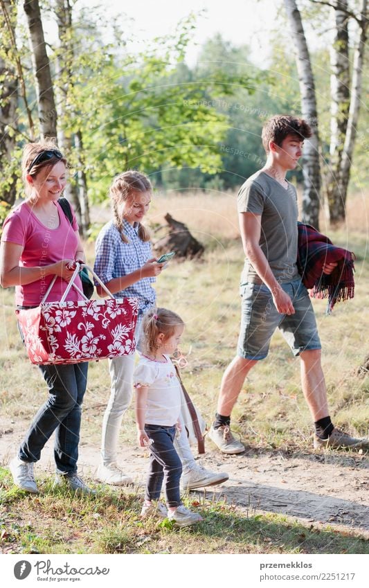 Family going on picnic to forest on sunny day Lifestyle Joy Happy Relaxation Leisure and hobbies Vacation & Travel Summer Child Girl Boy (child) Young woman