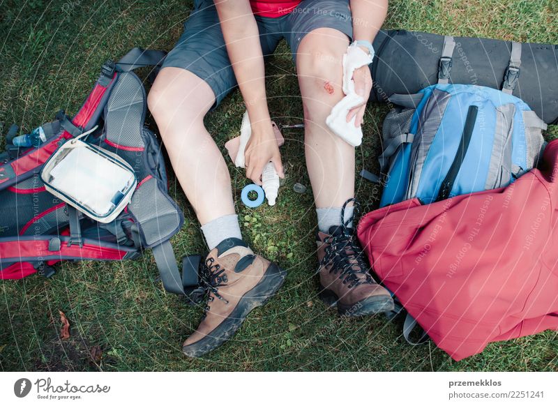 Woman dressing the wound on her knee with medicine in spray Lifestyle Vacation & Travel Summer Hiking Sports Human being Adults Legs 1 18 - 30 years