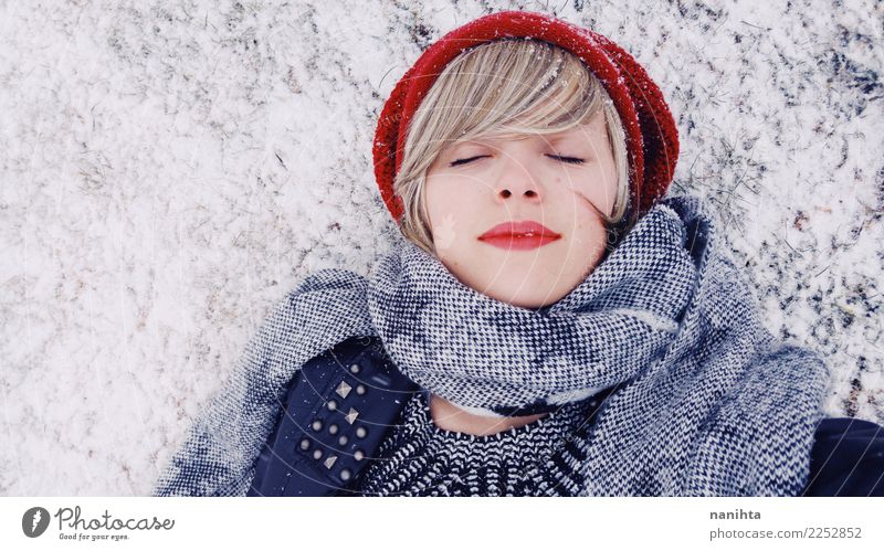 Young woman lying down over a snowy floor Lifestyle Style Beautiful Wellness Harmonious Senses Relaxation Winter Snow Winter vacation Christmas & Advent