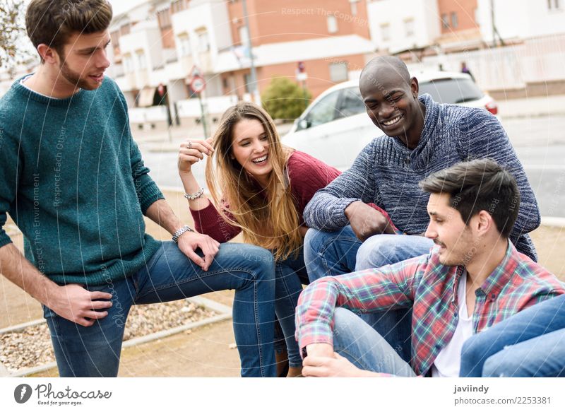 Group of multi-ethnic young people having fun together outdoors in urban background Lifestyle Joy Happy Academic studies Human being Young man