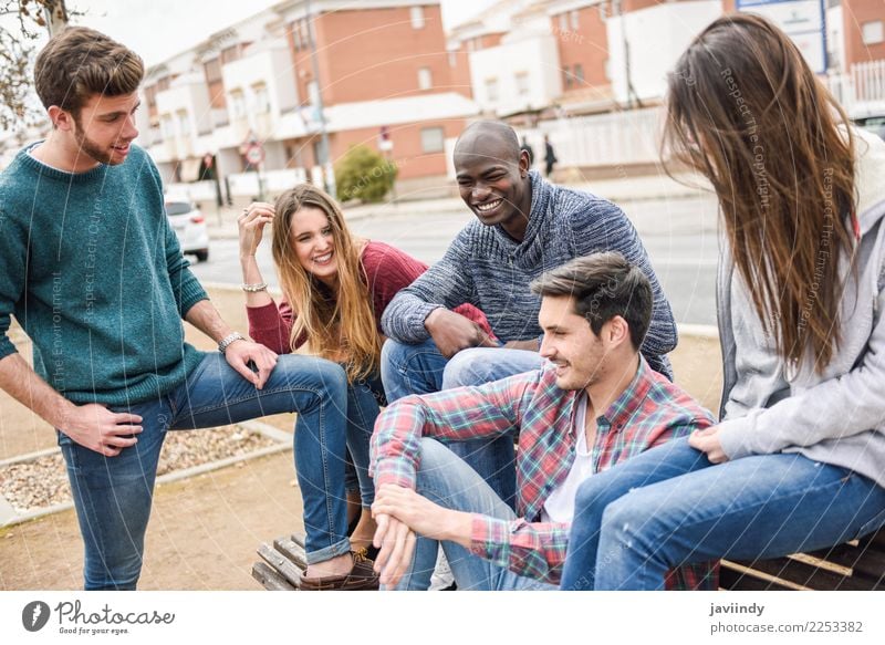 Group of multi-ethnic young people having fun together outdoors in urban background Lifestyle Joy Human being Young woman Youth (Young adults) Young man Woman