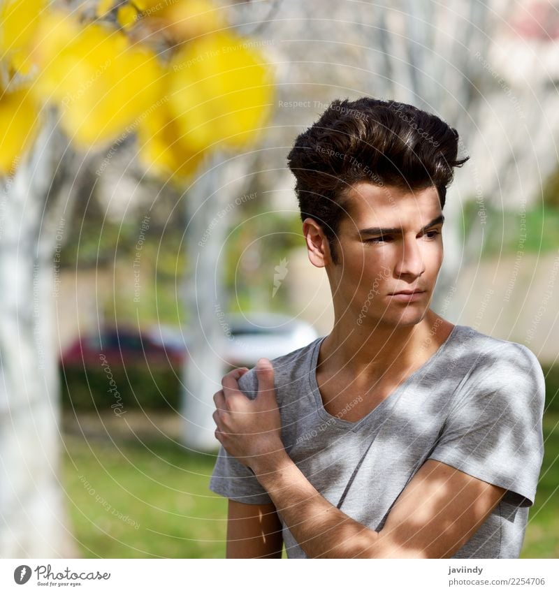 young man with modern hairstyle - a Royalty Free Stock Photo from Photocase