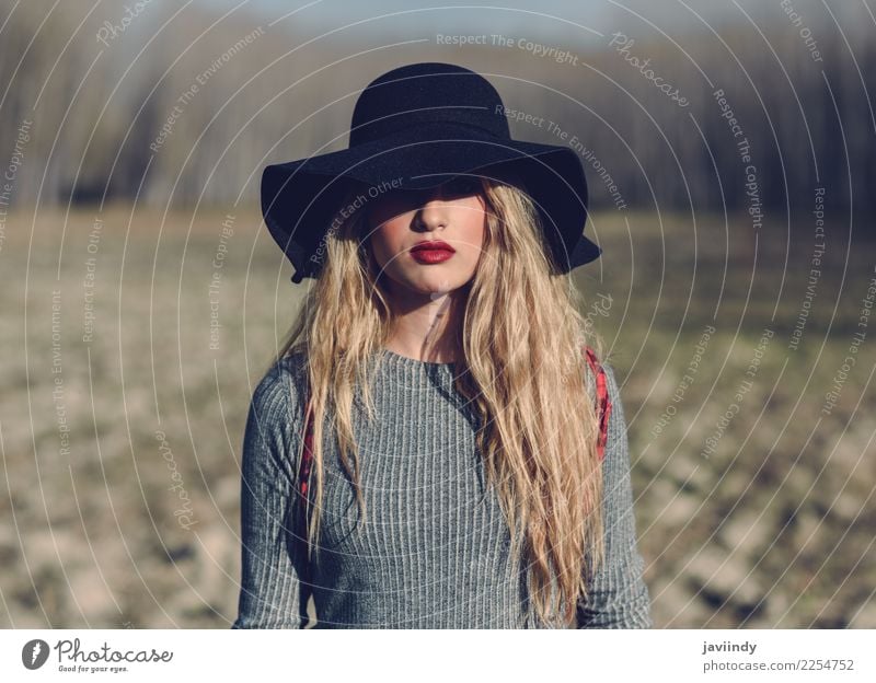 Young Woman In Stylish Clothes Against The Background Of The City, Romantic  Portrait. Portrait Of The Charming Blonde On The Street. Stock Photo,  Picture and Royalty Free Image. Image 77316524.