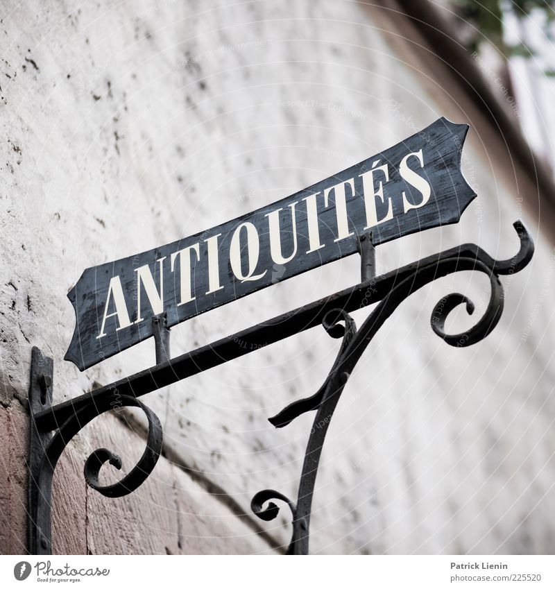 ANTIQUITÉS Building Wall (barrier) Wall (building) Stone Sign Signs and labeling Old Sharp-edged Elegant Beautiful Antiques dealer Ancient Decoration