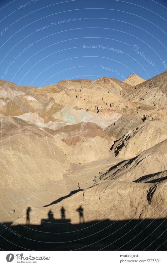 Four shadows in front of the mountain Tourism Adventure Far-off places Expedition Mountain Human being Man Adults Friendship 4 Nature Landscape Earth Sand Sky