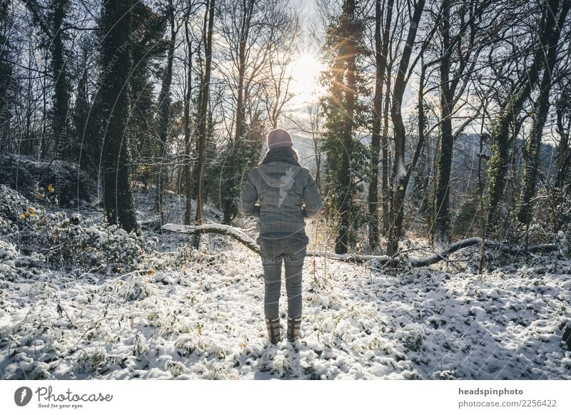 Young woman in a snow-covered forest looking into the sun Body Healthy Life Vacation & Travel Tourism Trip Winter vacation Hiking Feminine Youth (Young adults)