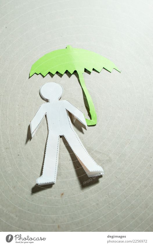 Fugire of men and umbrella Human being Man Adults Hand Weather Rain Paper Under Green Black White Safety Protection Insurance people cutout Cut Figure