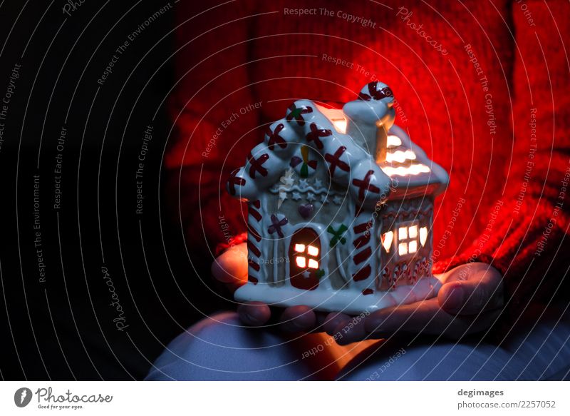 Christmas house. Candle light in the house. Winter Snow House (Residential Structure) Decoration Feasts & Celebrations Christmas & Advent Woman Adults Hand