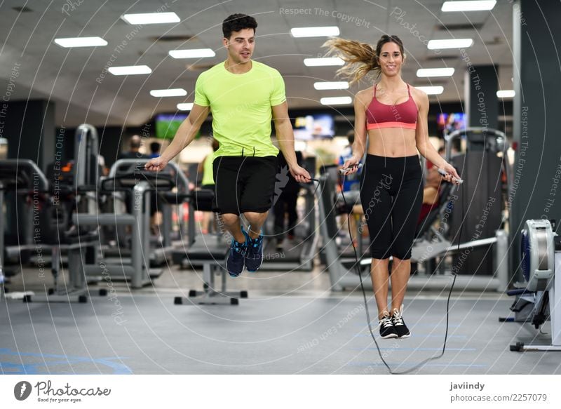 Young man and woman workout with jumping rope Lifestyle Joy Happy Beautiful Sports Rope Human being Masculine Feminine Young woman Youth (Young adults) Woman