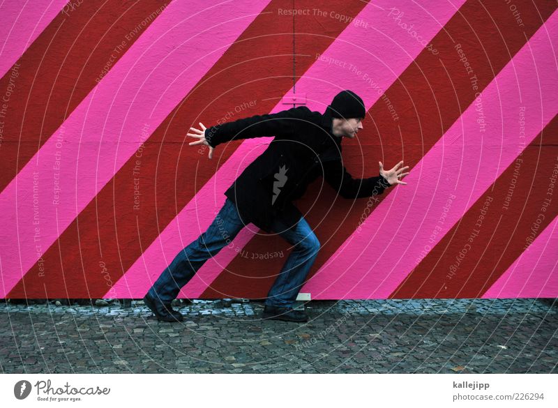 - step - Human being Masculine Man Adults 1 30 - 45 years Coat Cap Looking Pink Red Line Fence Going Dynamics Hoarding Colour photo Day Full-length Adjustment