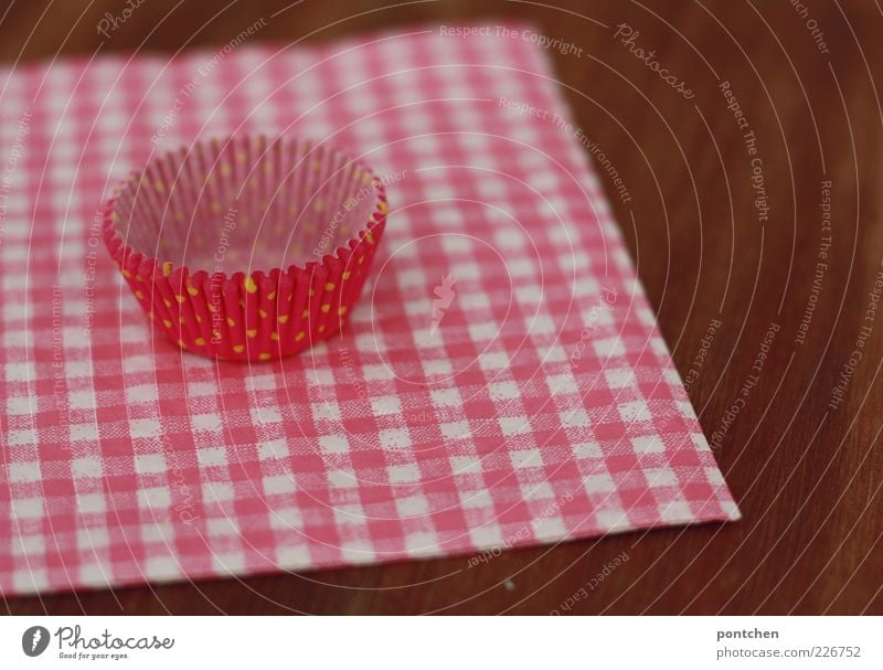 Pink cupcake shape made of paper lies on a pink and white checked napkin. Cute, cheesy. Decoration wood Napkin Checkered Muffin Paper Kitsch Reddish white