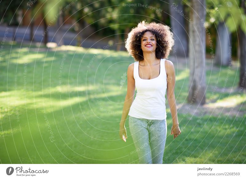 Mixed woman with afro hairstyle smiling in urban park Lifestyle Hair and hairstyles Summer Human being Feminine Young woman Youth (Young adults) Woman Adults 1