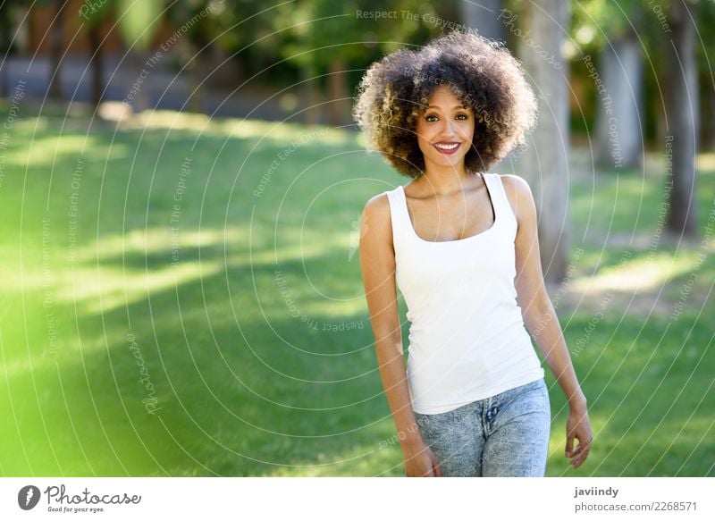 Black woman with afro hairstyle smiling in urban park Lifestyle Beautiful Hair and hairstyles Summer Human being Feminine Young woman Youth (Young adults) Woman