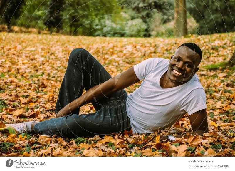 Park II. Contentment Vacation & Travel Human being Masculine Young man Youth (Young adults) Man Adults Culture Nature Autumn Leaf Jeans Lie Natural Tolerant